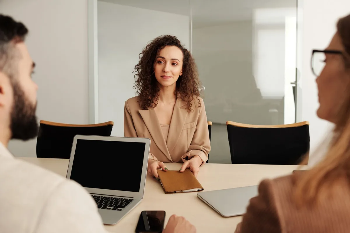 An owner interviewing their first team member