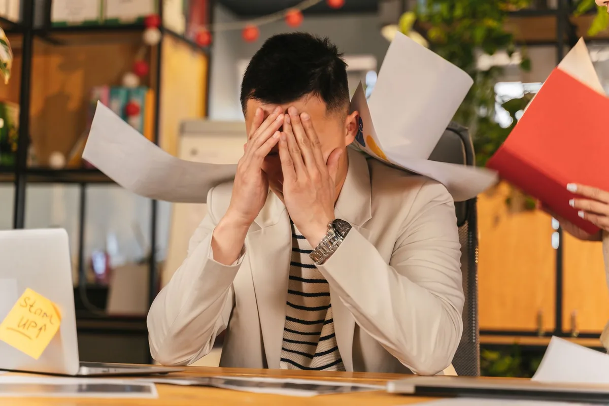An overwhelmed owner seeing the signs their business needs an advisor
